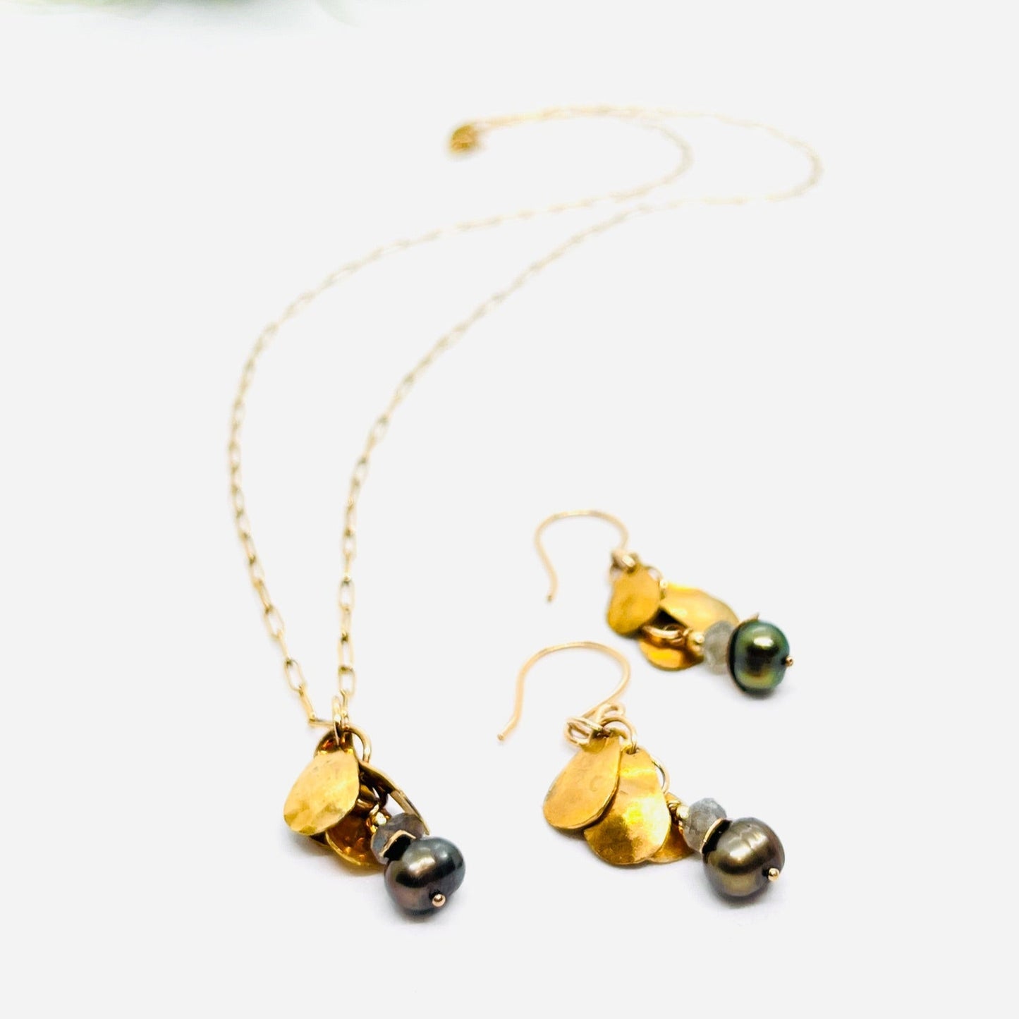 Pictured with the matching earrings. Sold separately.